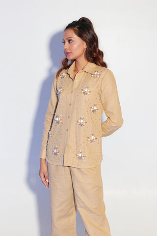 Beige co-ord set in pure linen with stone embellishment on shirt.