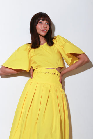 Yellow dress with a buttoned waist and box pleat.