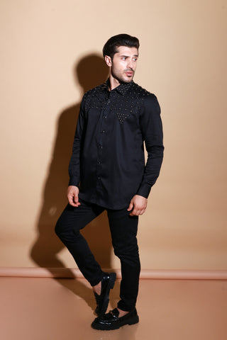 Black full sleeve shirt with muted stud detailing .