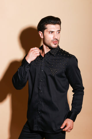 Black full sleeve shirt with muted stud detailing .