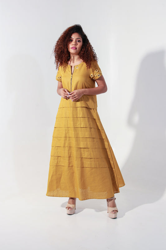 Ochre yellow maxi A-line dress with self panels and a tie-up detail at the back.