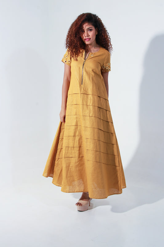 Ochre yellow maxi A-line dress with self panels and a tie-up detail at the back.