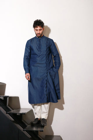 Denim long length kurta with self pleat detailing on side placket and collar with narrow off white pants.