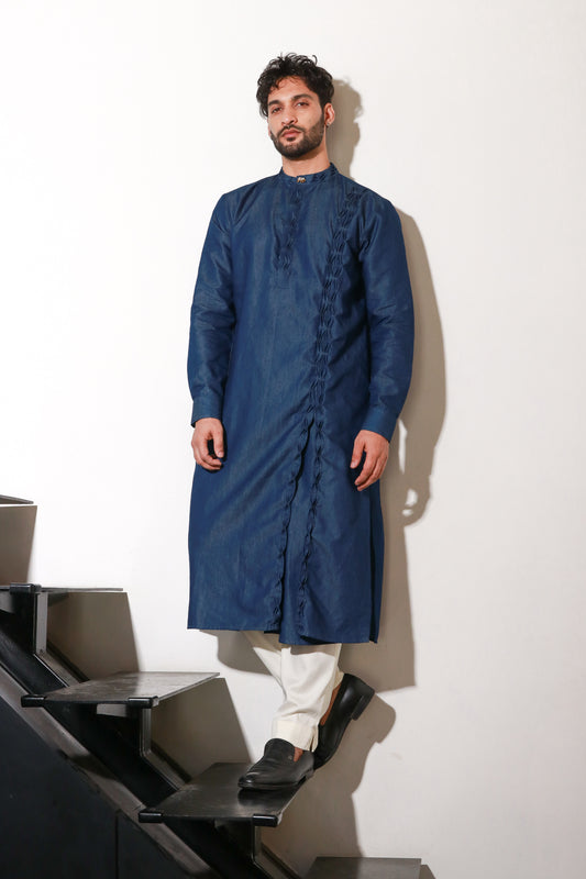 Denim long length kurta with self pleat detailing on side placket and collar with narrow off white pants.