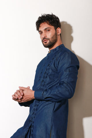 Denim long length kurta with self pleat detailing on side placket and collar with narrow off white pants.