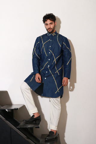 Denim knee length kurta with abstract crepe print detailing and off white narrow pants.