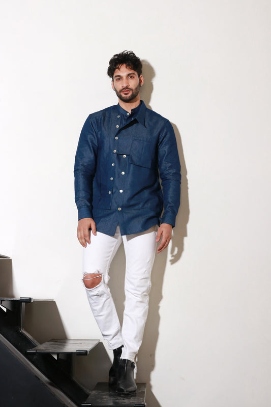 Classic denim shirt with extended collar and pocket feature.