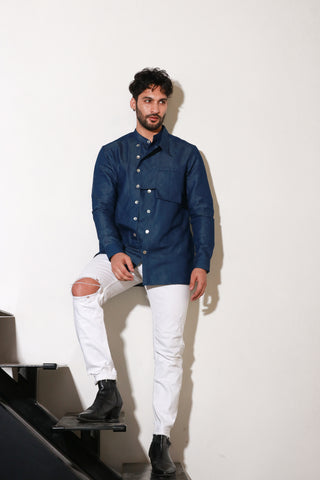 Classic denim shirt with extended collar and pocket feature.