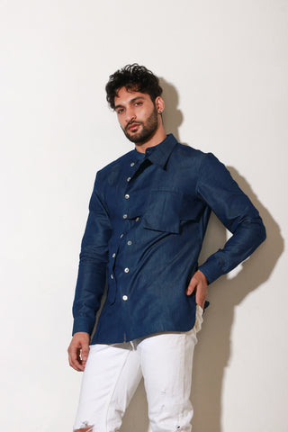 Classic denim shirt with extended collar and pocket feature.