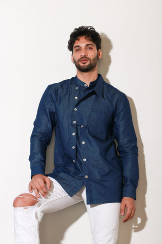 Classic denim shirt with extended collar and pocket feature.