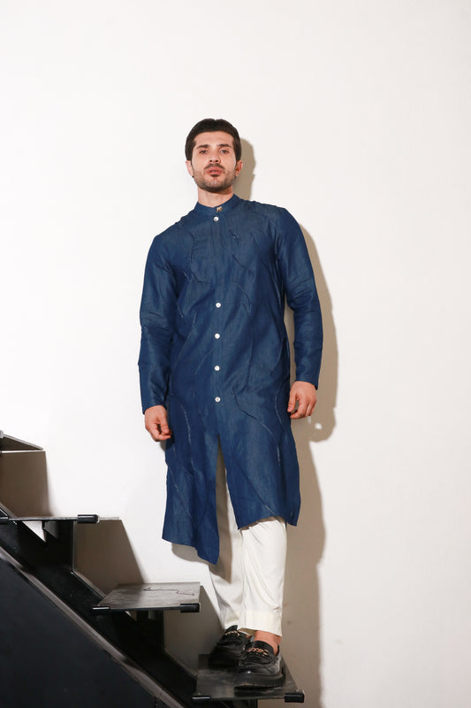 Denim long kurta with self pleating detailing paired with off white narrow pants.