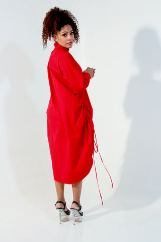 Red top doubles up as a short dress and features a high collar and pull up detailing on the front.