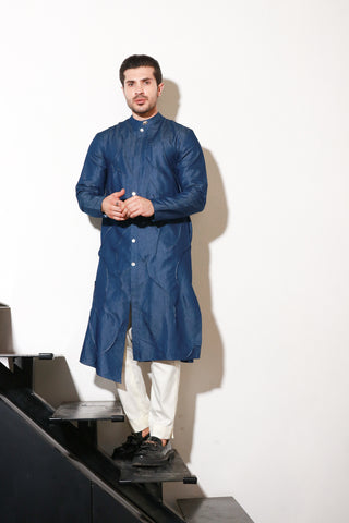 Denim long kurta with self pleating detailing paired with off white narrow pants.