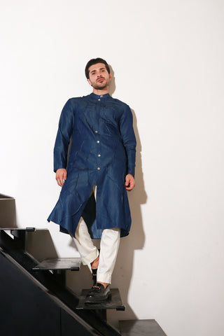 Denim long kurta with self pleating detailing paired with off white narrow pants.