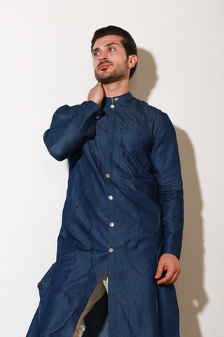 Denim long kurta with self pleating detailing paired with off white narrow pants.