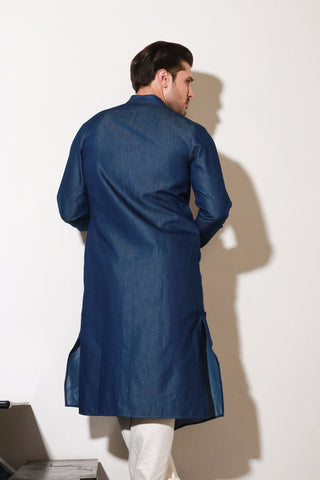 Denim long kurta with self pleating detailing paired with off white narrow pants.