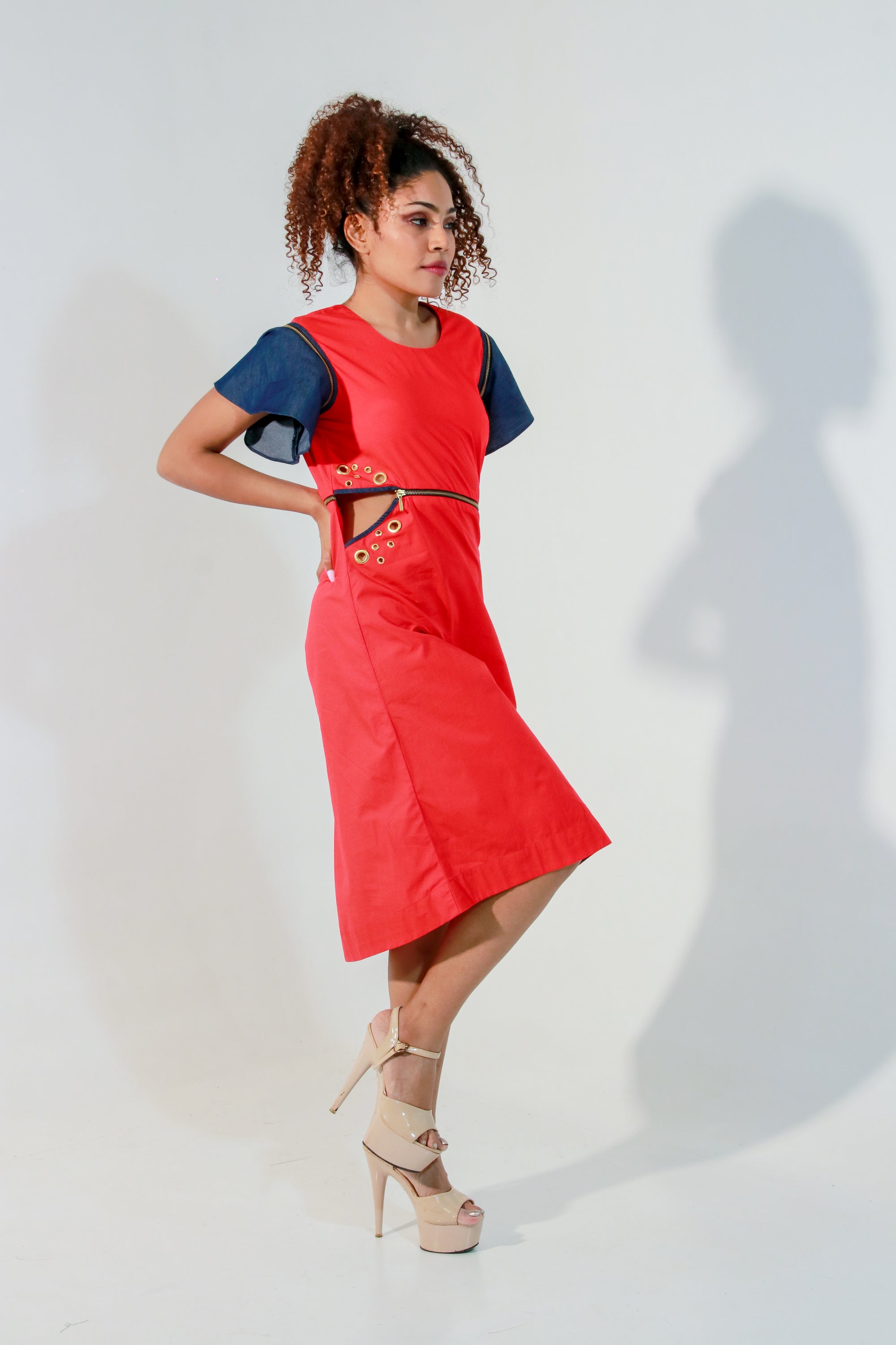 Coral dress with waist zipper and cut out feature
