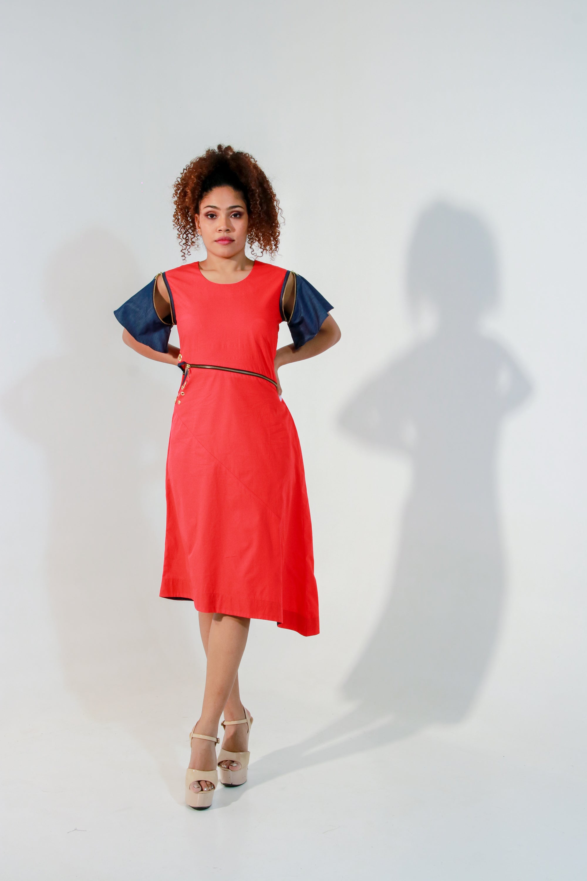 Coral dress with waist zipper and cut out feature