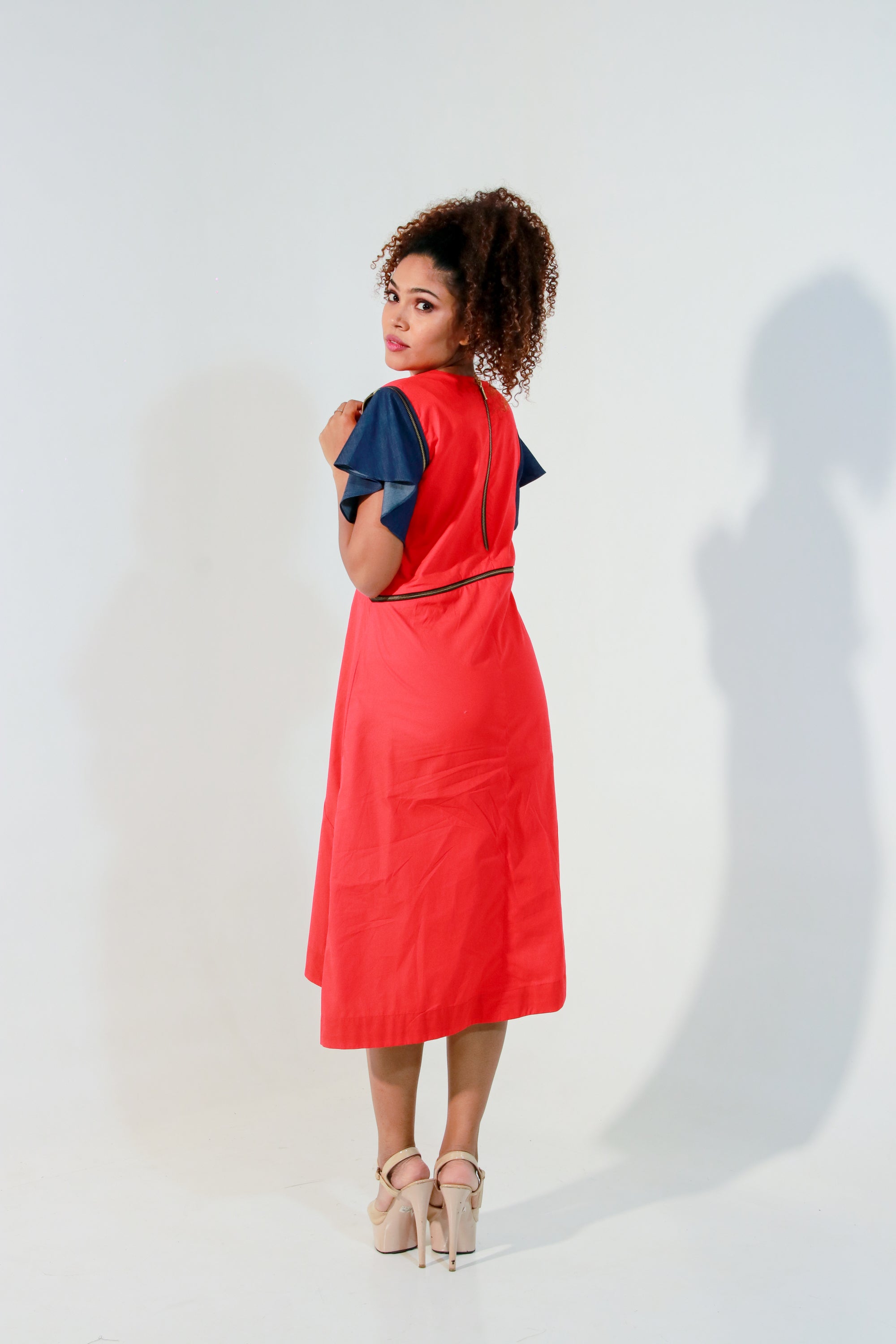 Coral dress with waist zipper and cut out feature