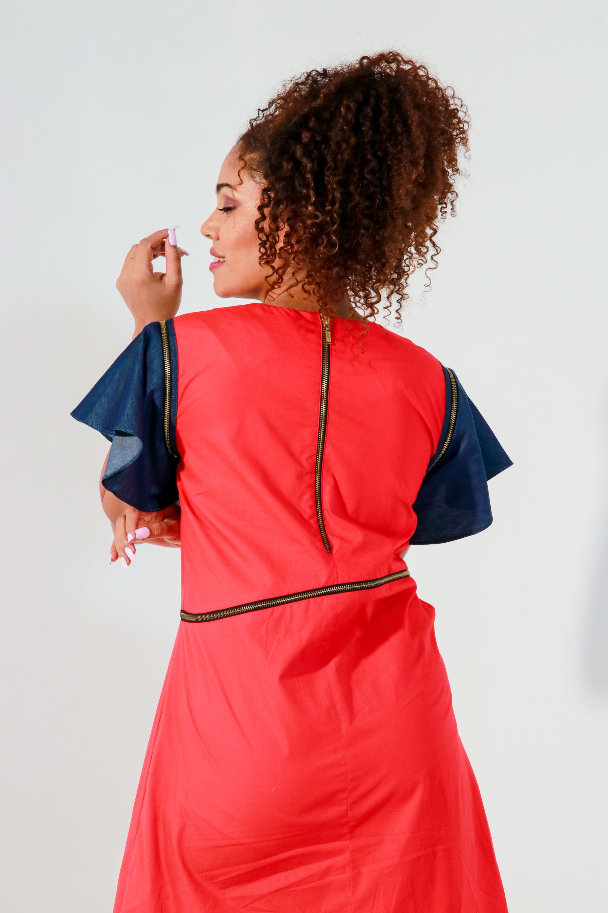 Coral dress with waist zipper and cut out feature