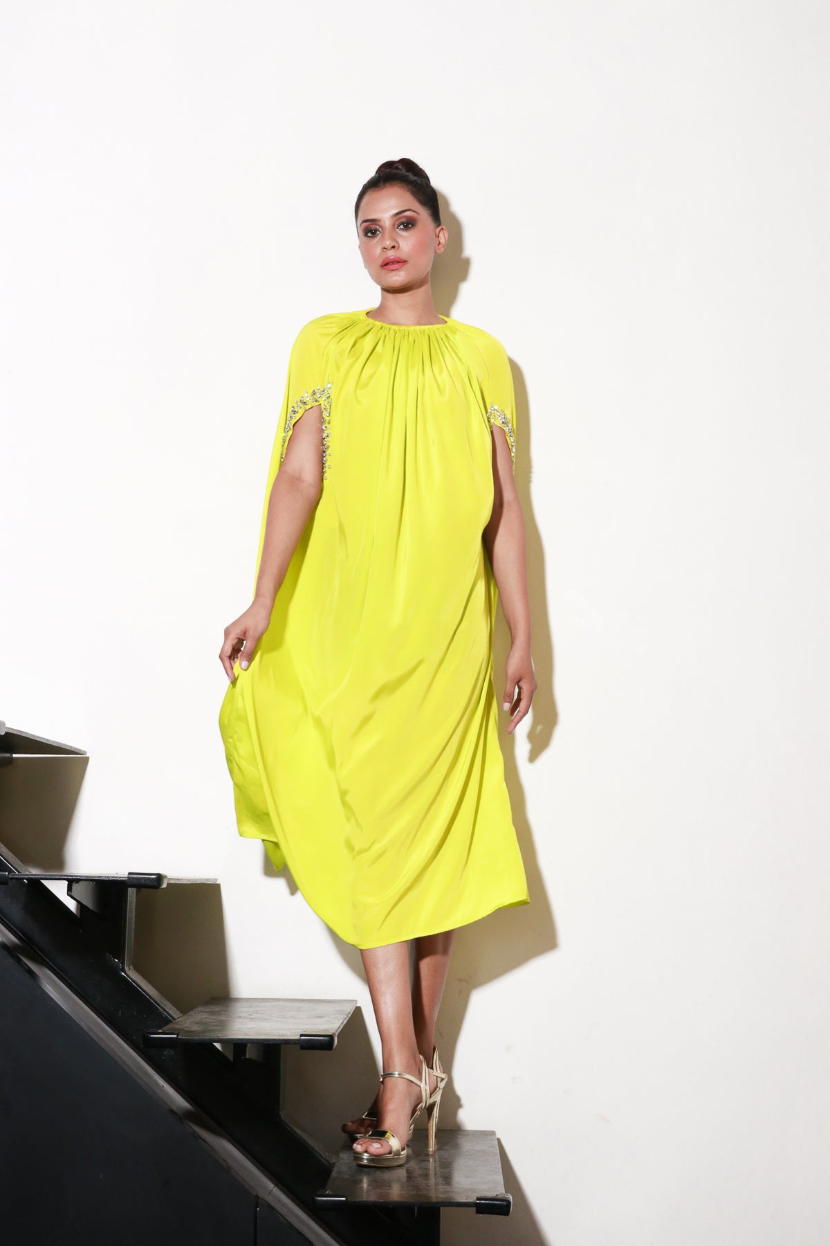 Lime yellow crepe dress with embellished cut-out sleeves.