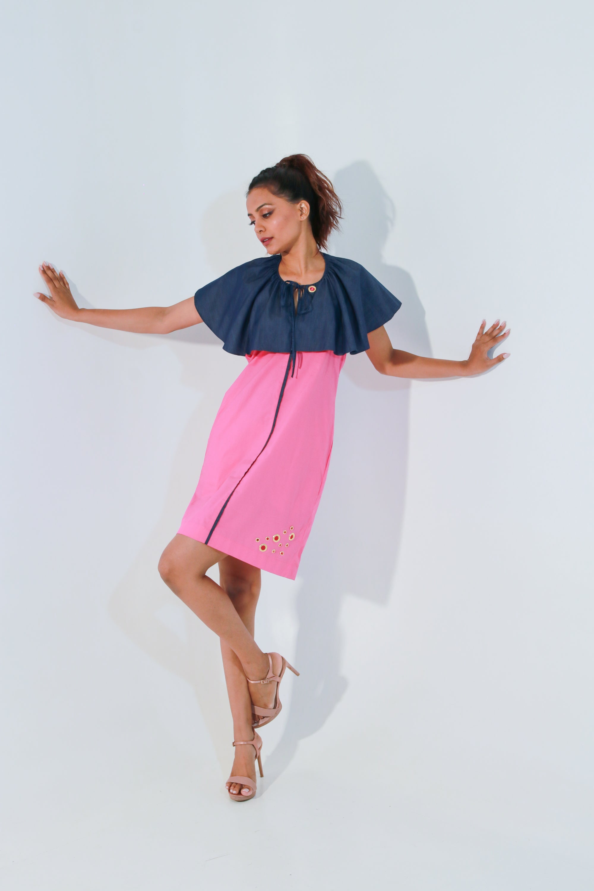 Pink and denim dress with cape feature