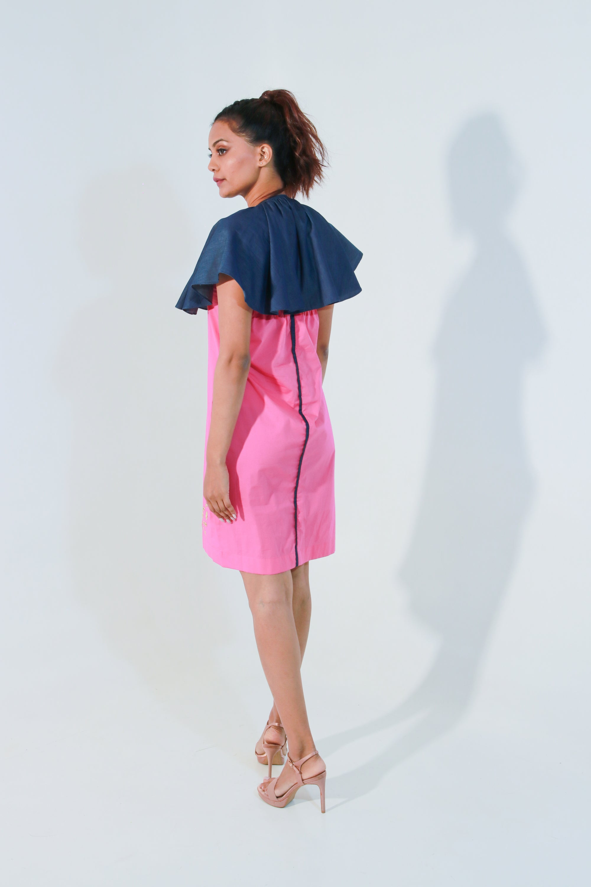 Pink and denim dress with cape feature