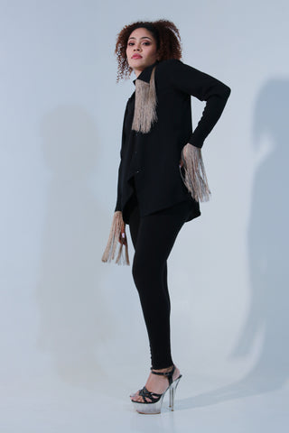 Black shirt is crafted in rayon with full sleeves with extended collar and tassels detailing.