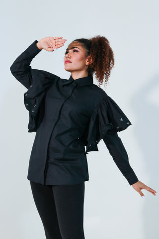 Black shirt features with bee embellishments and frill on the sleeves.