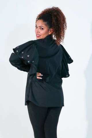 Black shirt features with bee embellishments and frill on the sleeves.