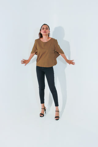 Brown top features angular slit sleeves and round neck.