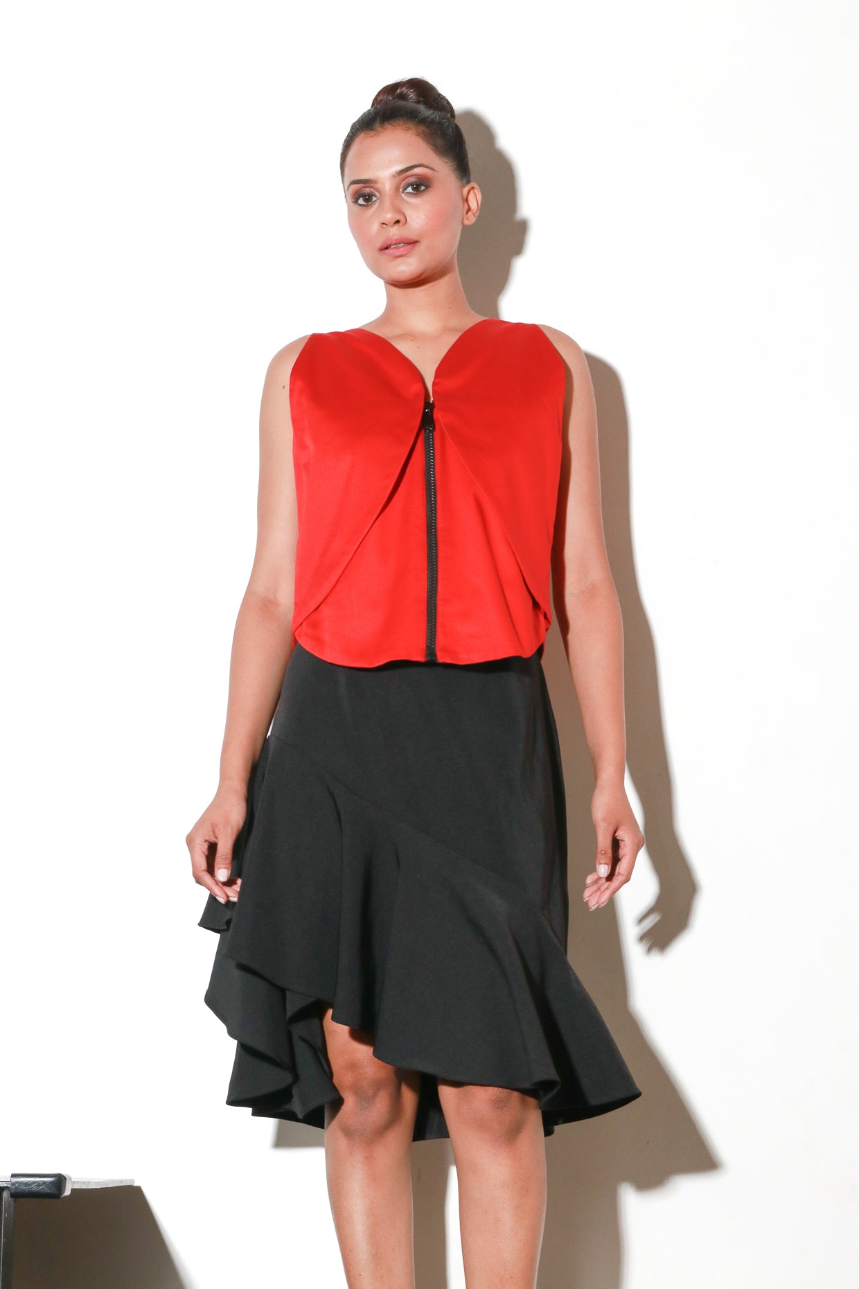 Sleeveless zippered red geometric flap crop top.