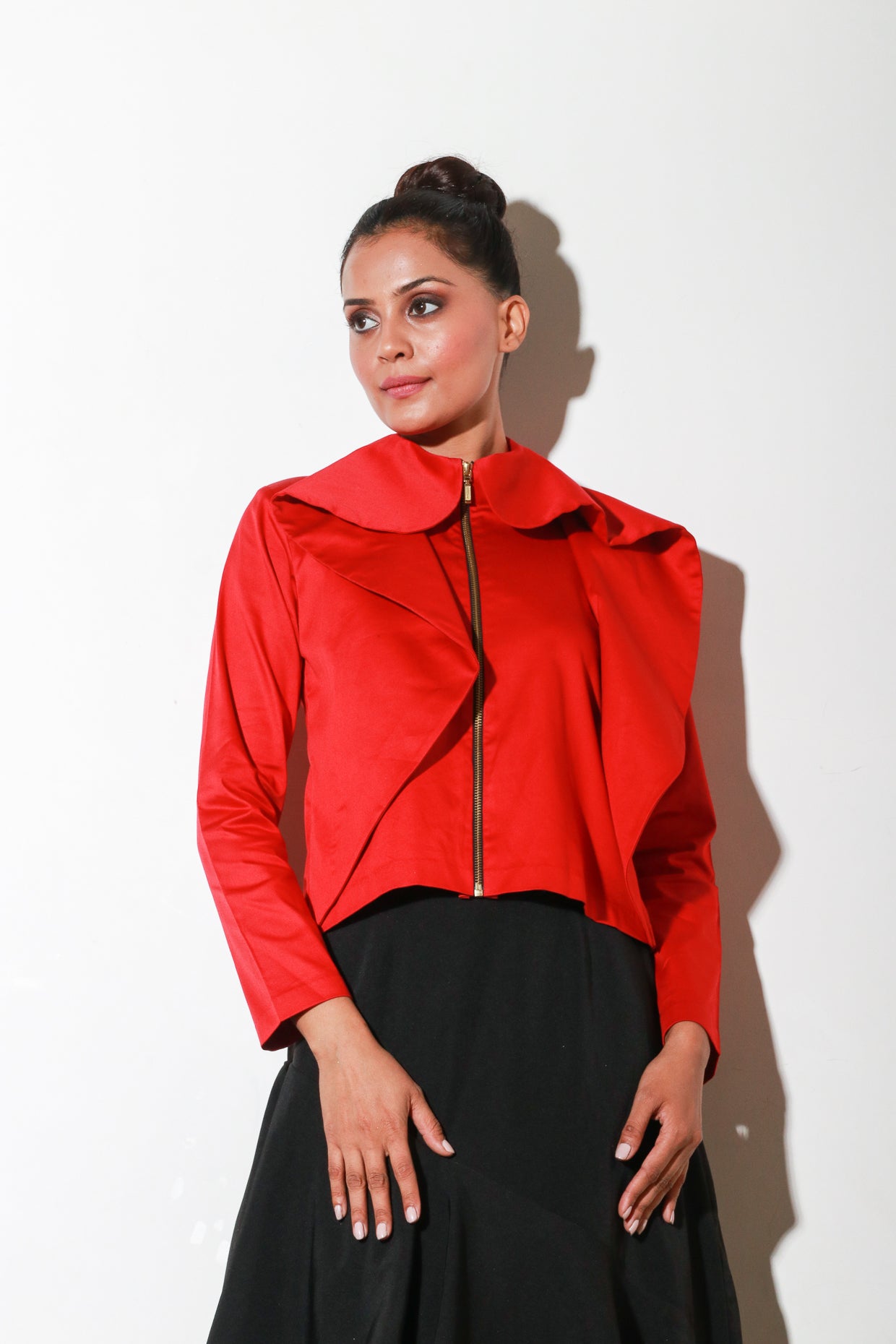 Red zipper shirt with flared collar feature.