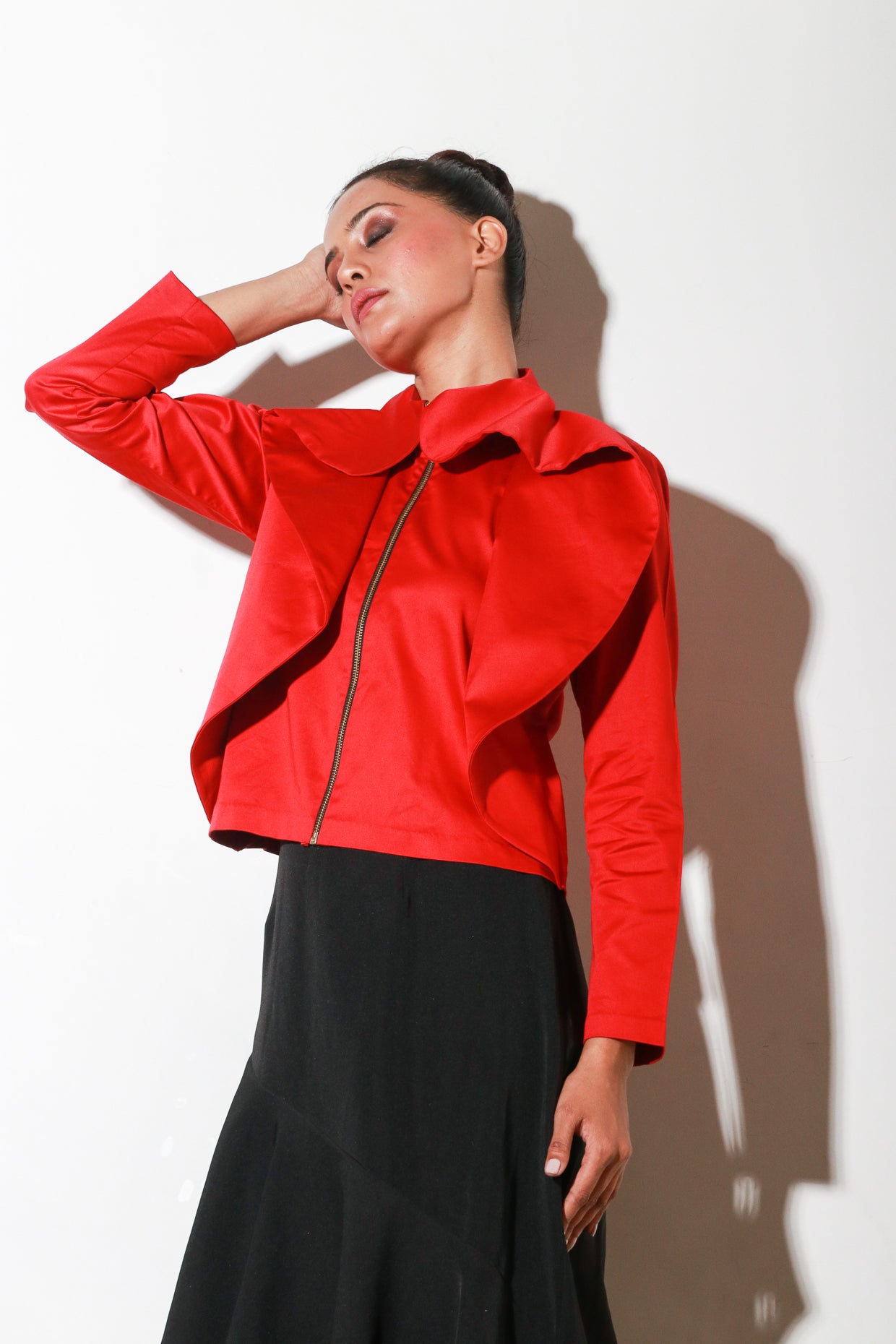 Red zipper shirt with flared collar feature.