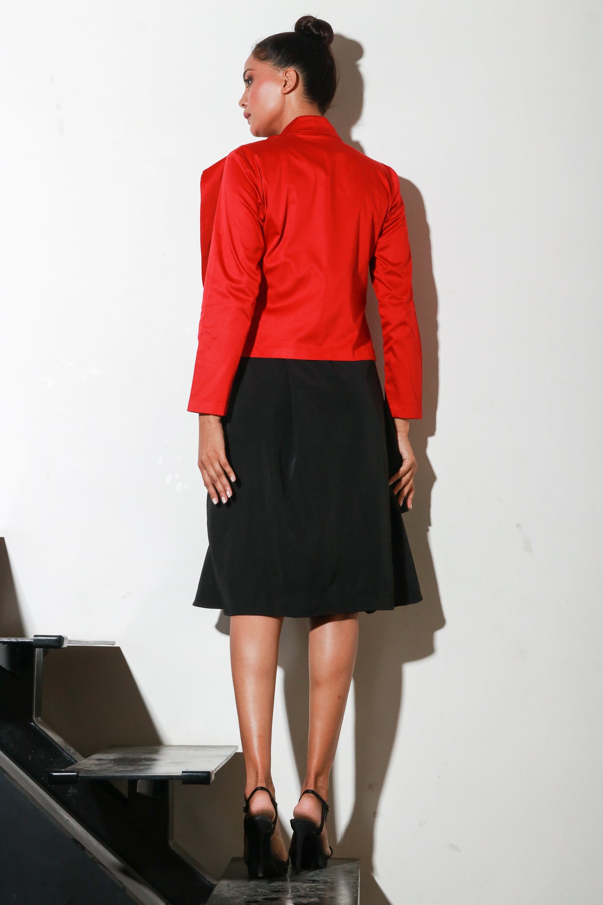 Red zipper shirt with flared collar feature.