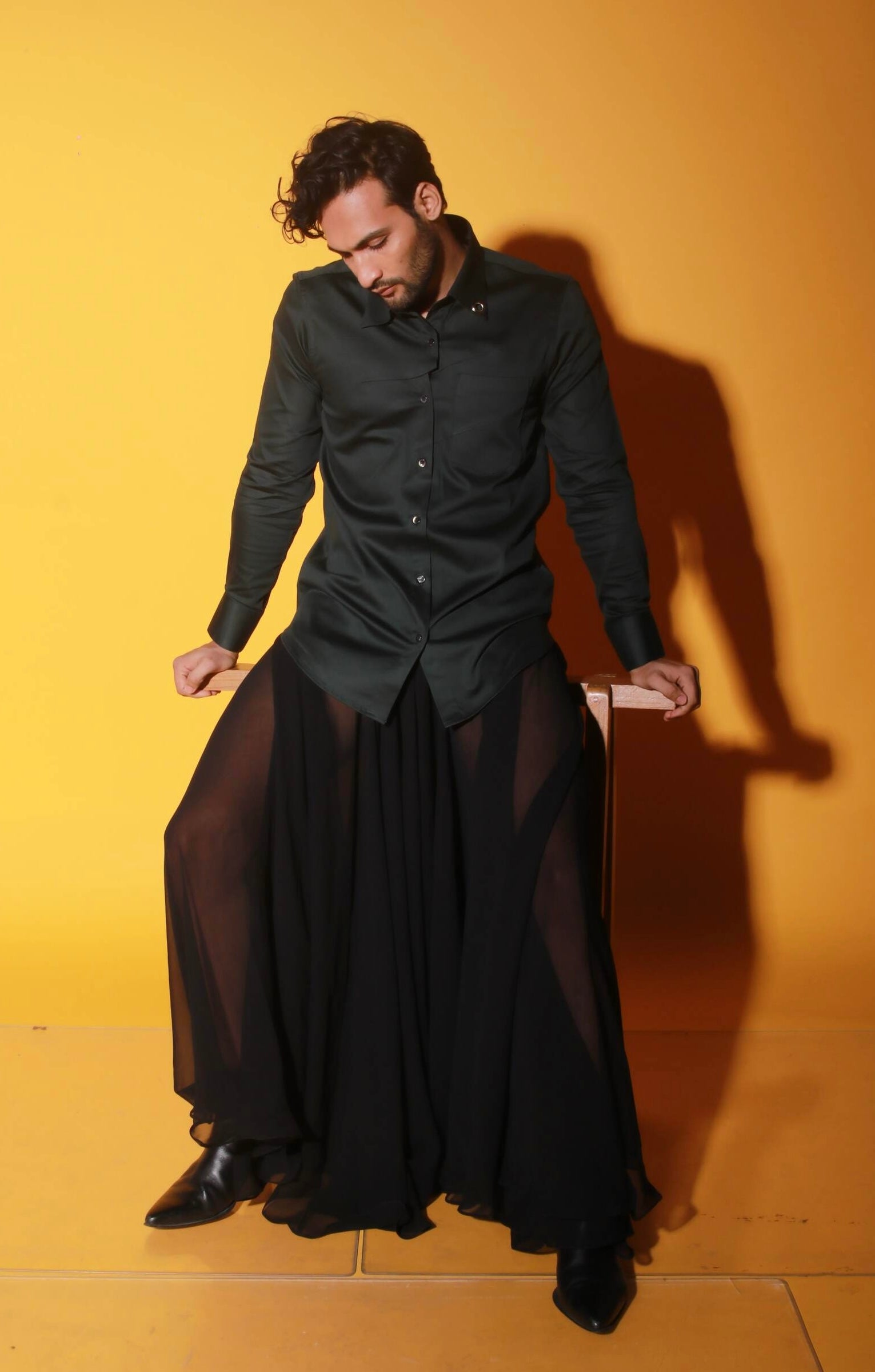 Dark green shirt with two diagonal folds