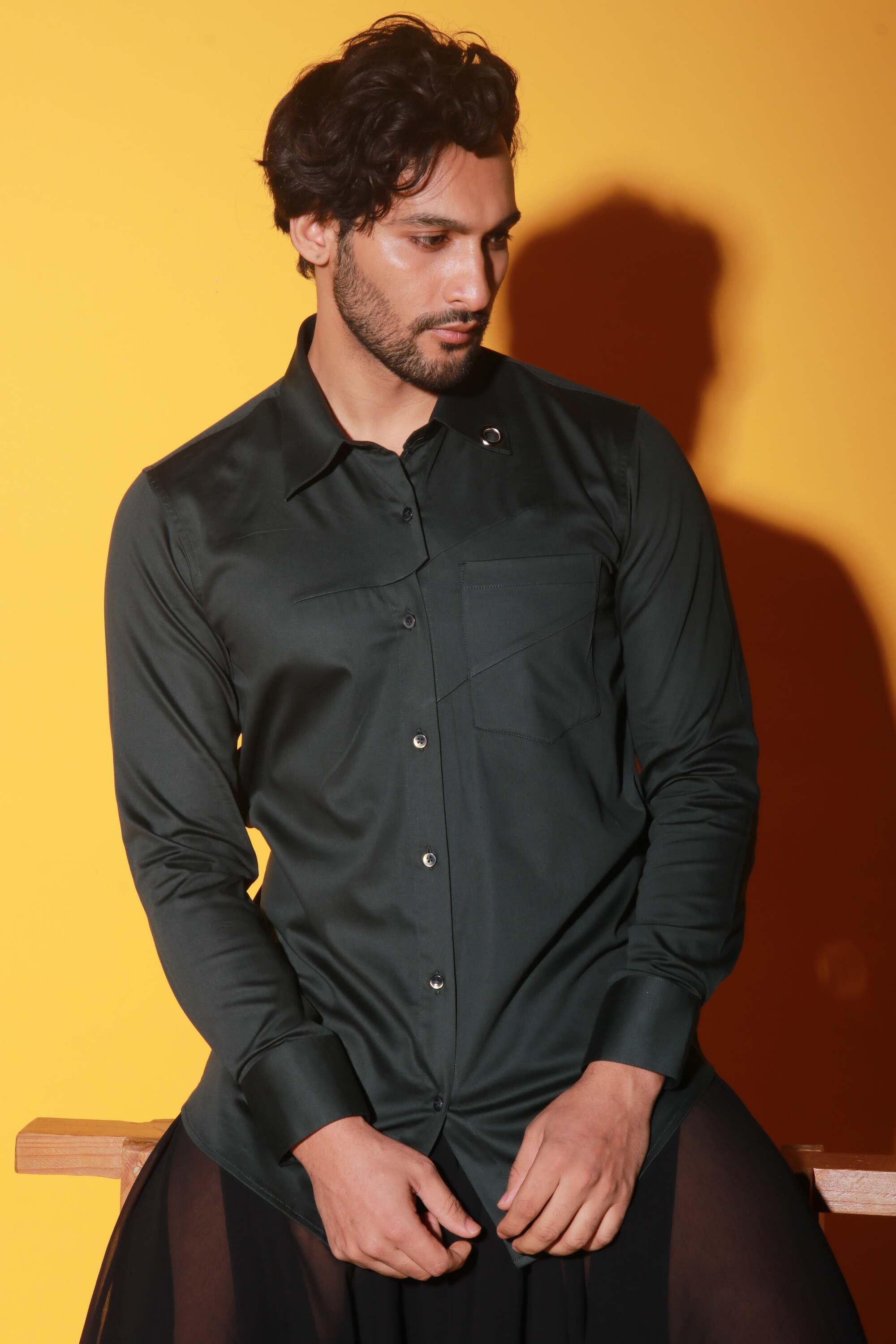 Dark green shirt with two diagonal folds