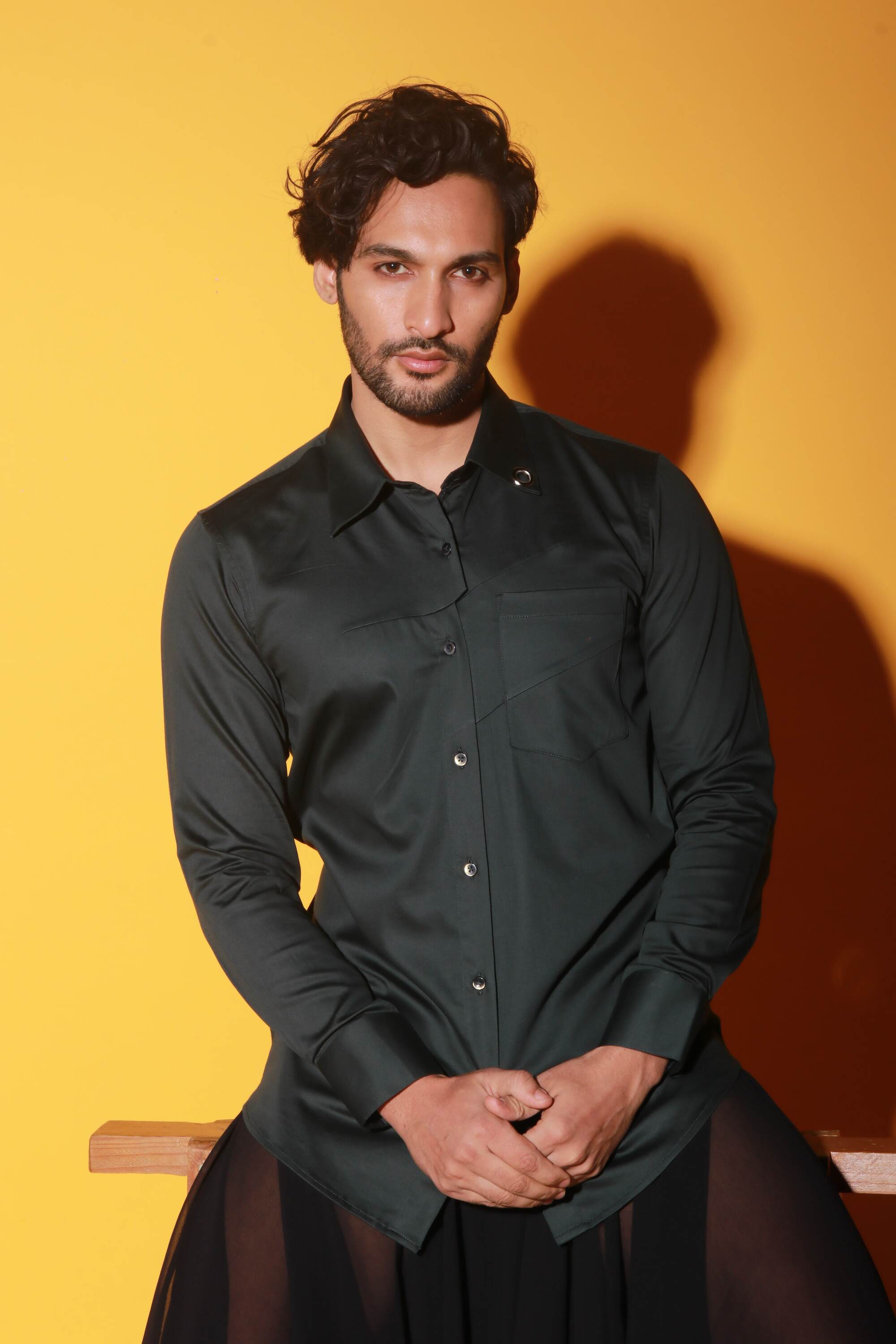 Dark green shirt with two diagonal folds