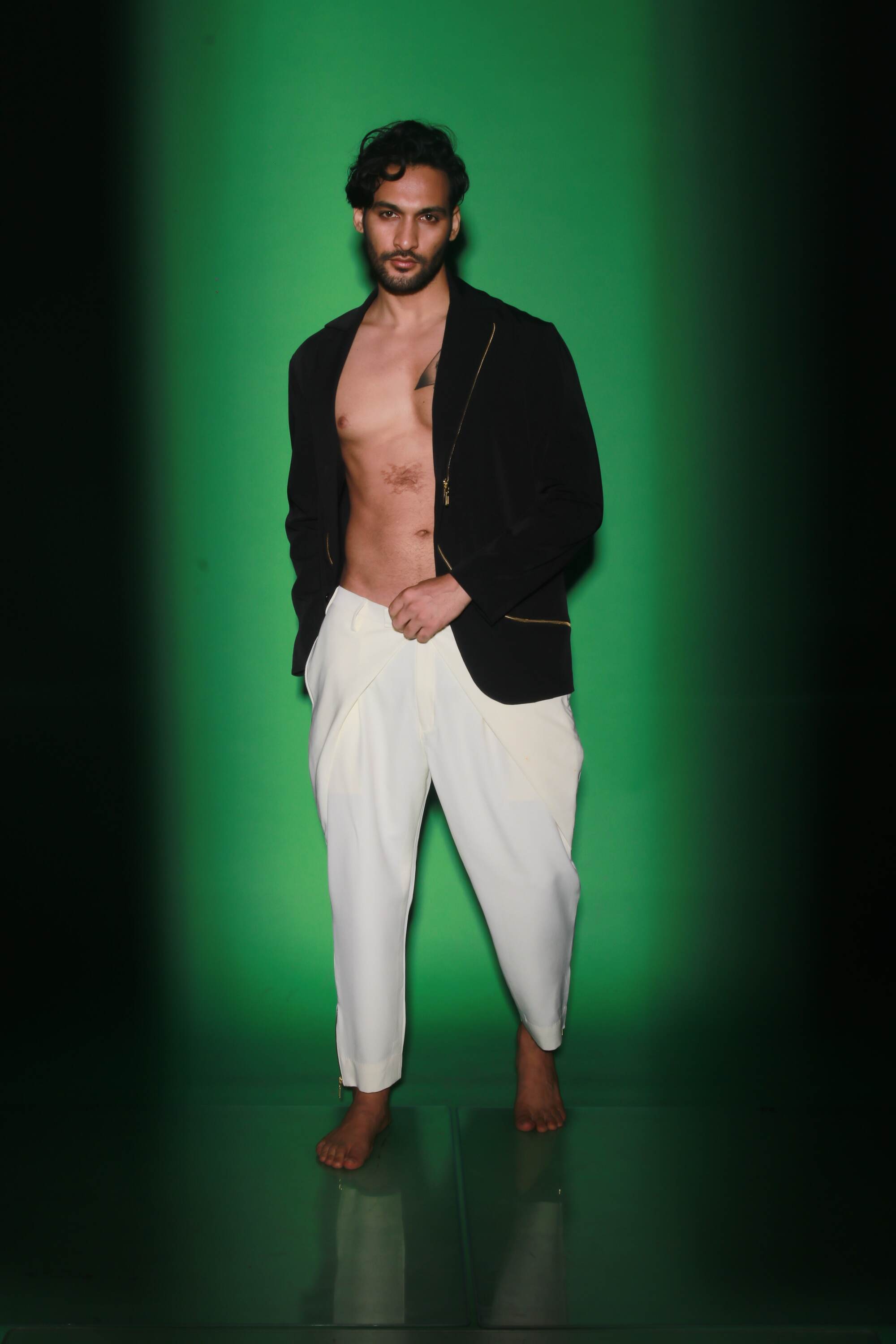 Black jacket with zipper accents paired with cream narrow double flap pants.