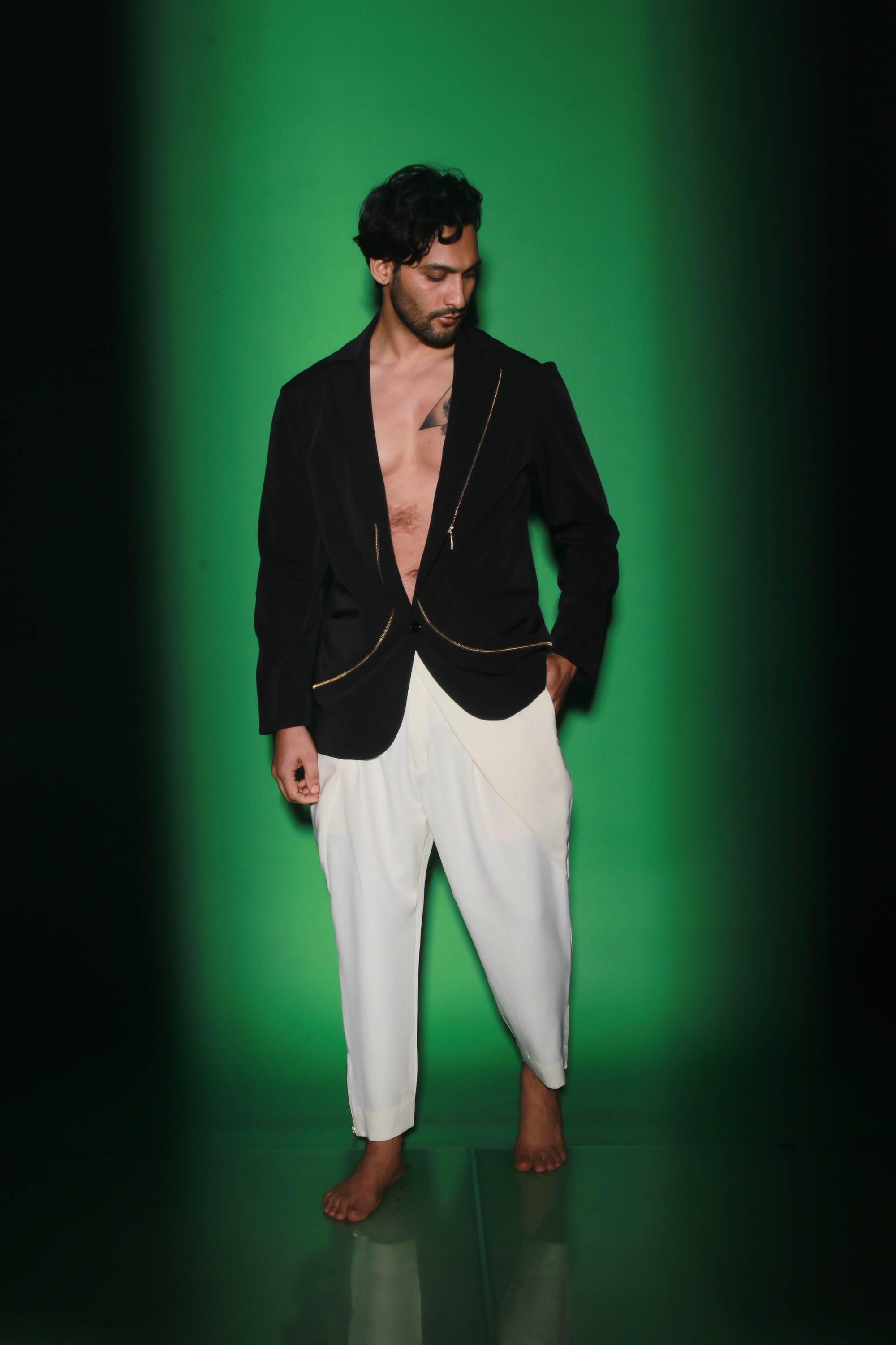 Black jacket with zipper accents paired with cream narrow double flap pants.