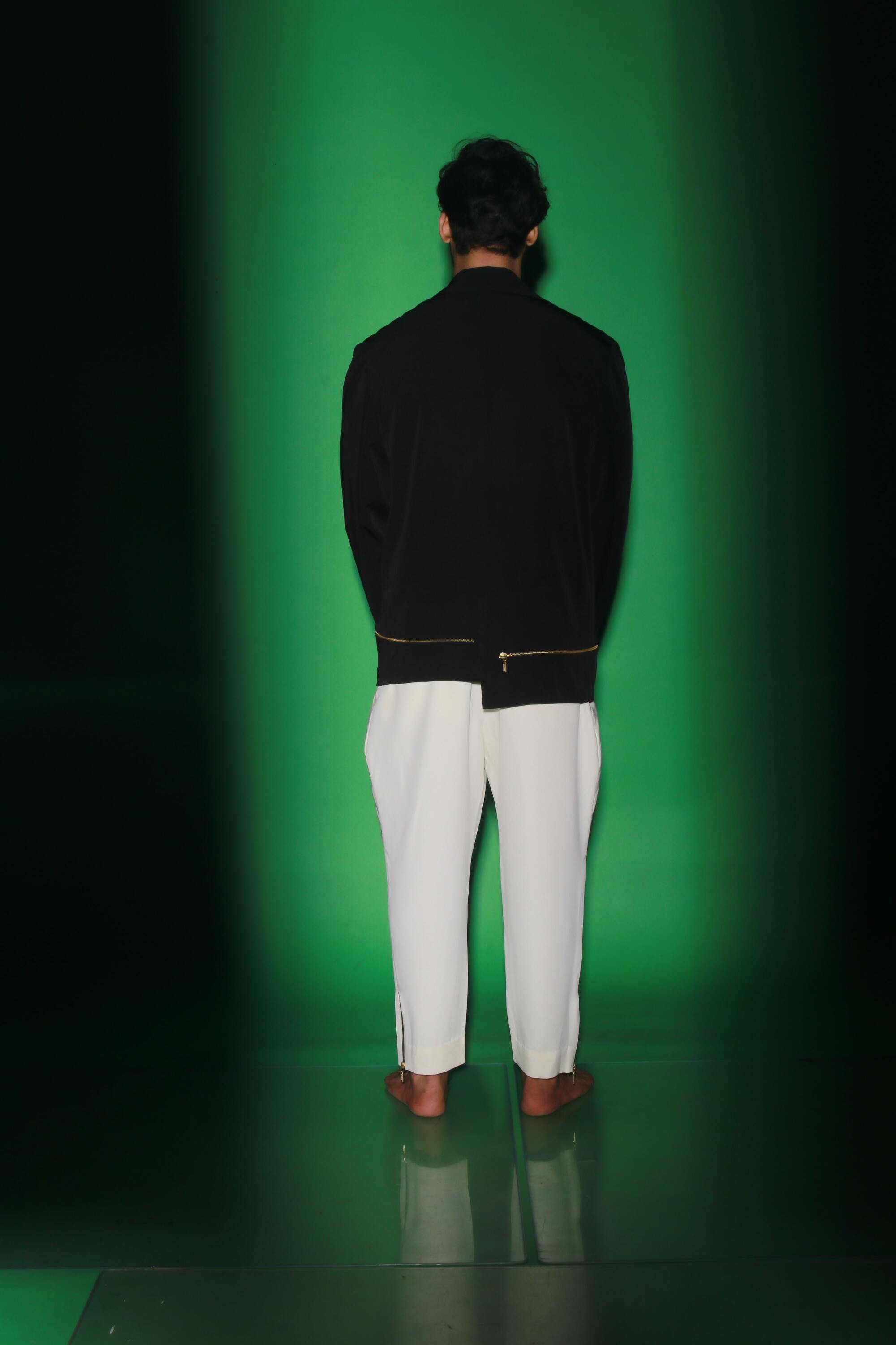 Black jacket with zipper accents paired with cream narrow double flap pants.