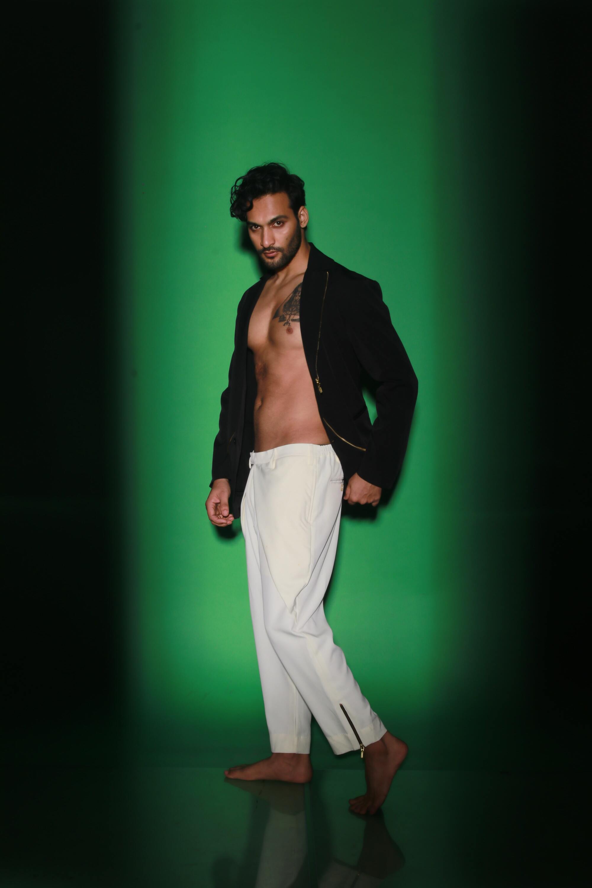 Black jacket with zipper accents paired with cream narrow double flap pants.