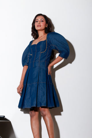 Denim short flared dress with structured sleeves and rivets feature.