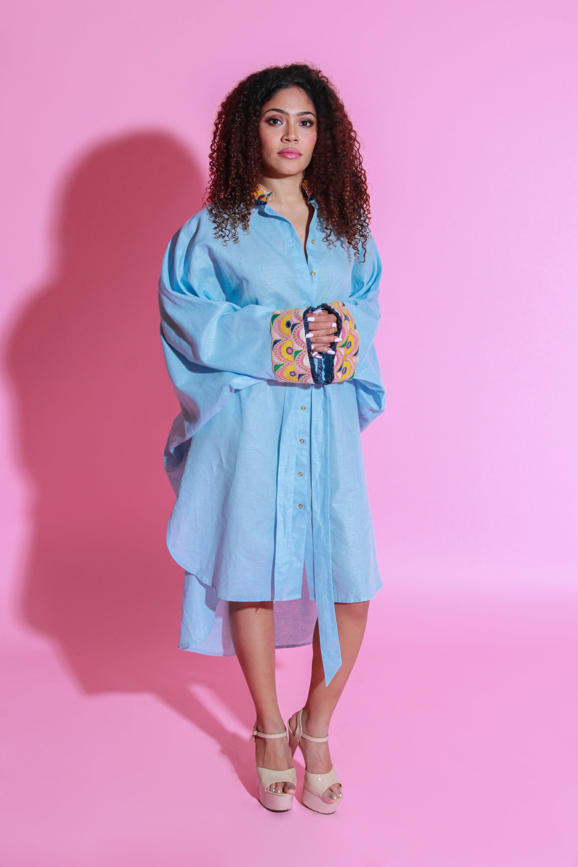 Sky blue dress crafted in pure linen, half belt feature and Kutch embroidery with apple hemline.