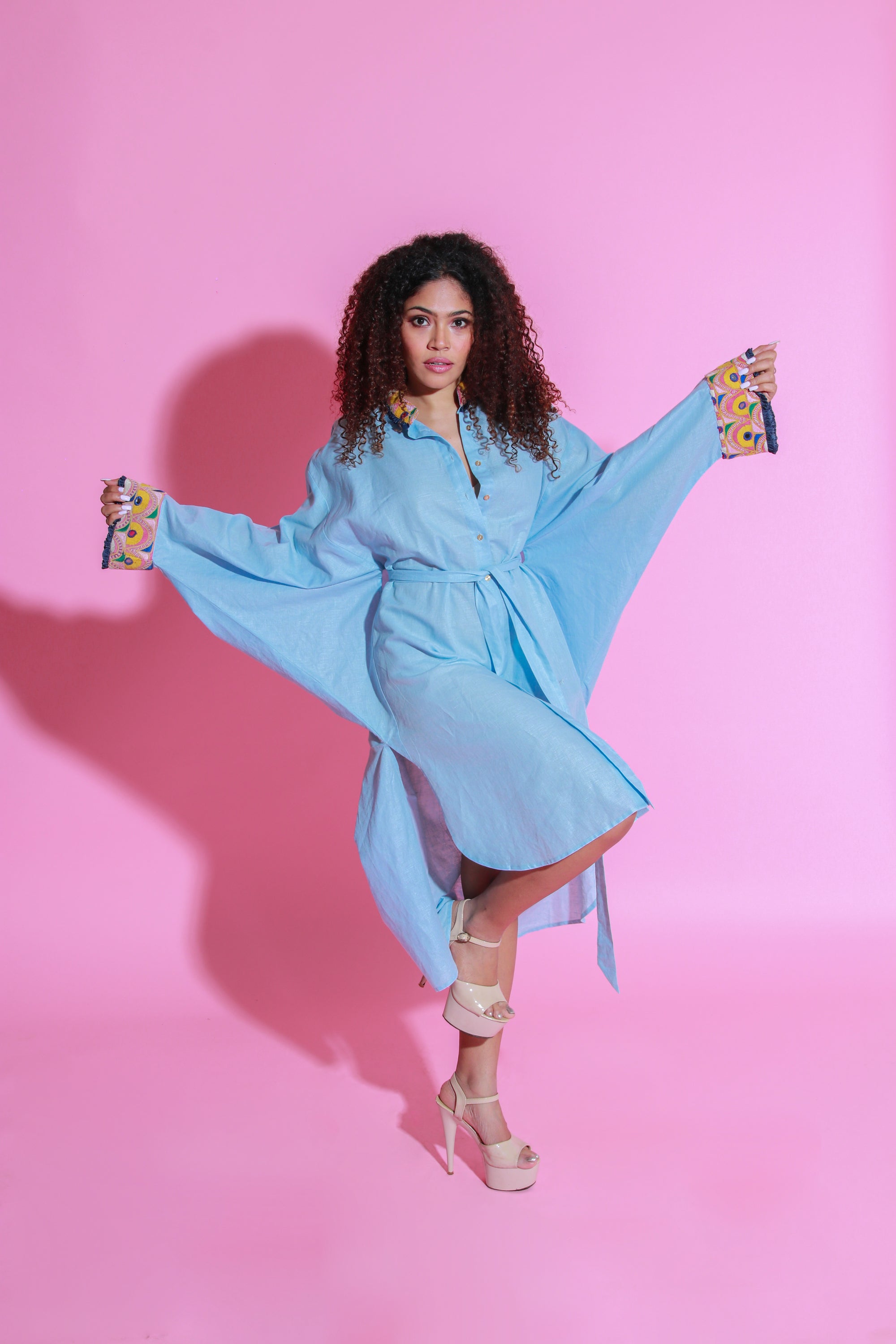 Sky blue dress crafted in pure linen, half belt feature and Kutch embroidery with apple hemline.