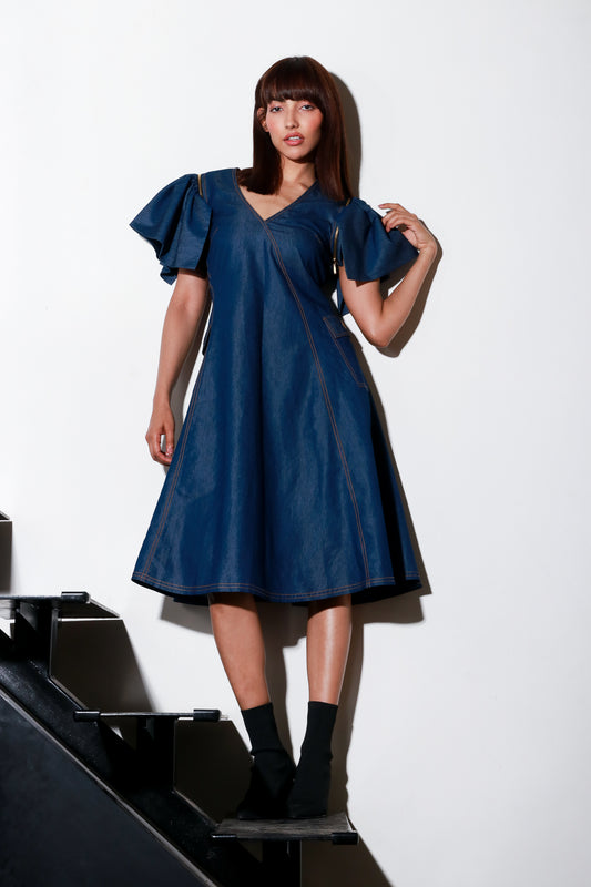 Denim flared midi-dress with detachable sleeves and side two pockets.