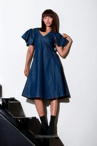 Denim flared midi-dress with detachable sleeves and side two pockets.