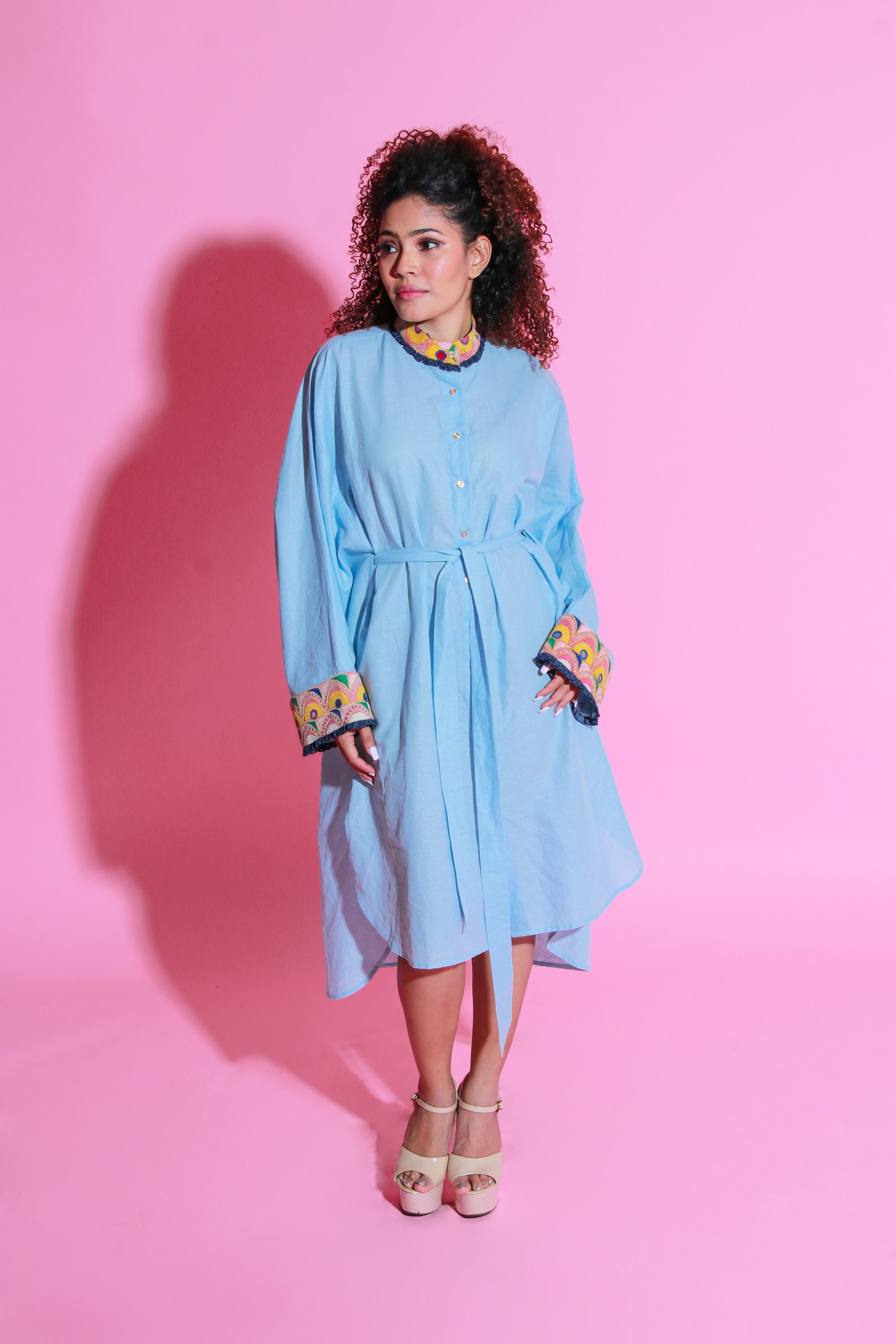 Sky blue dress crafted in pure linen, half belt feature and Kutch embroidery with apple hemline.