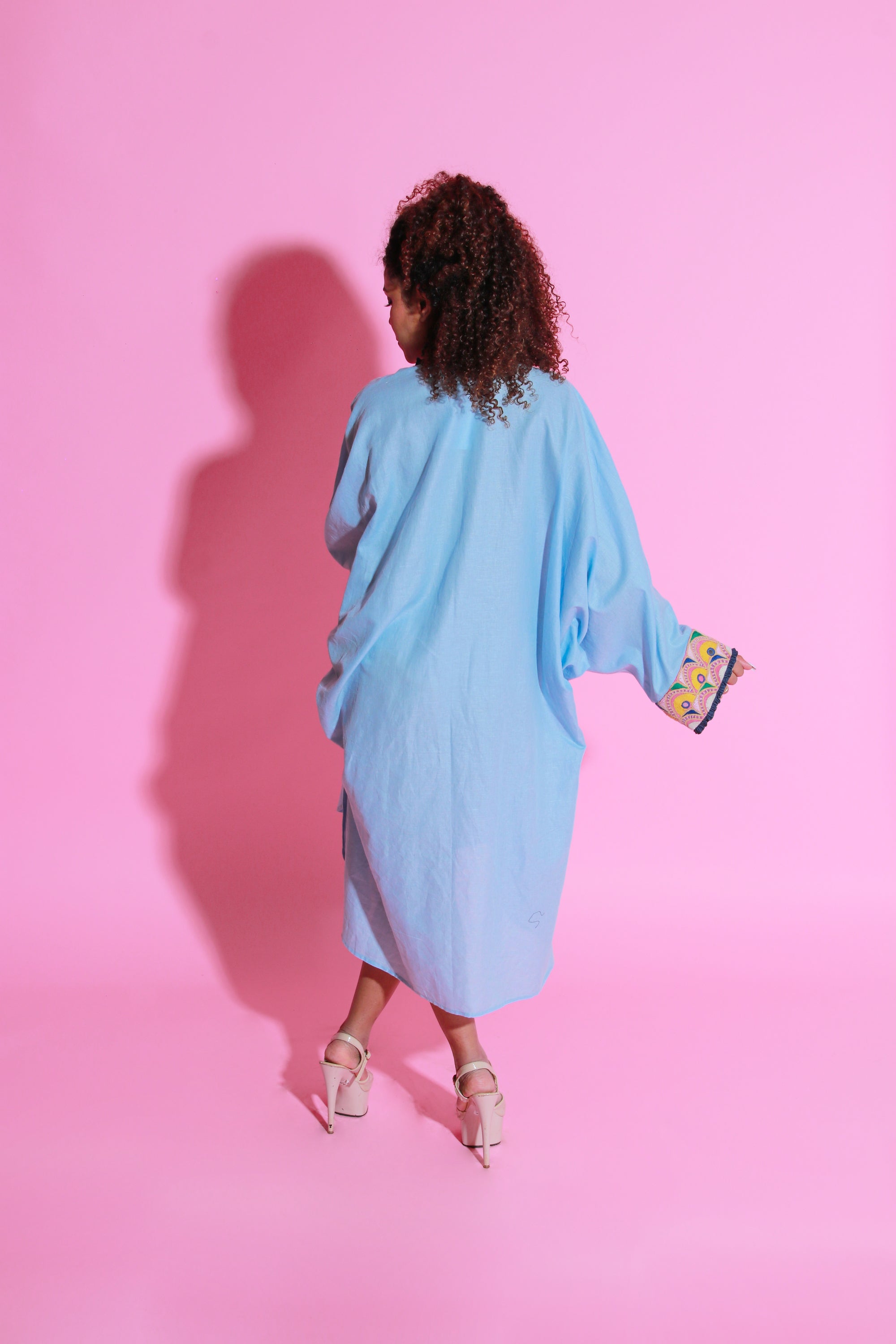 Sky blue dress crafted in pure linen, half belt feature and Kutch embroidery with apple hemline.