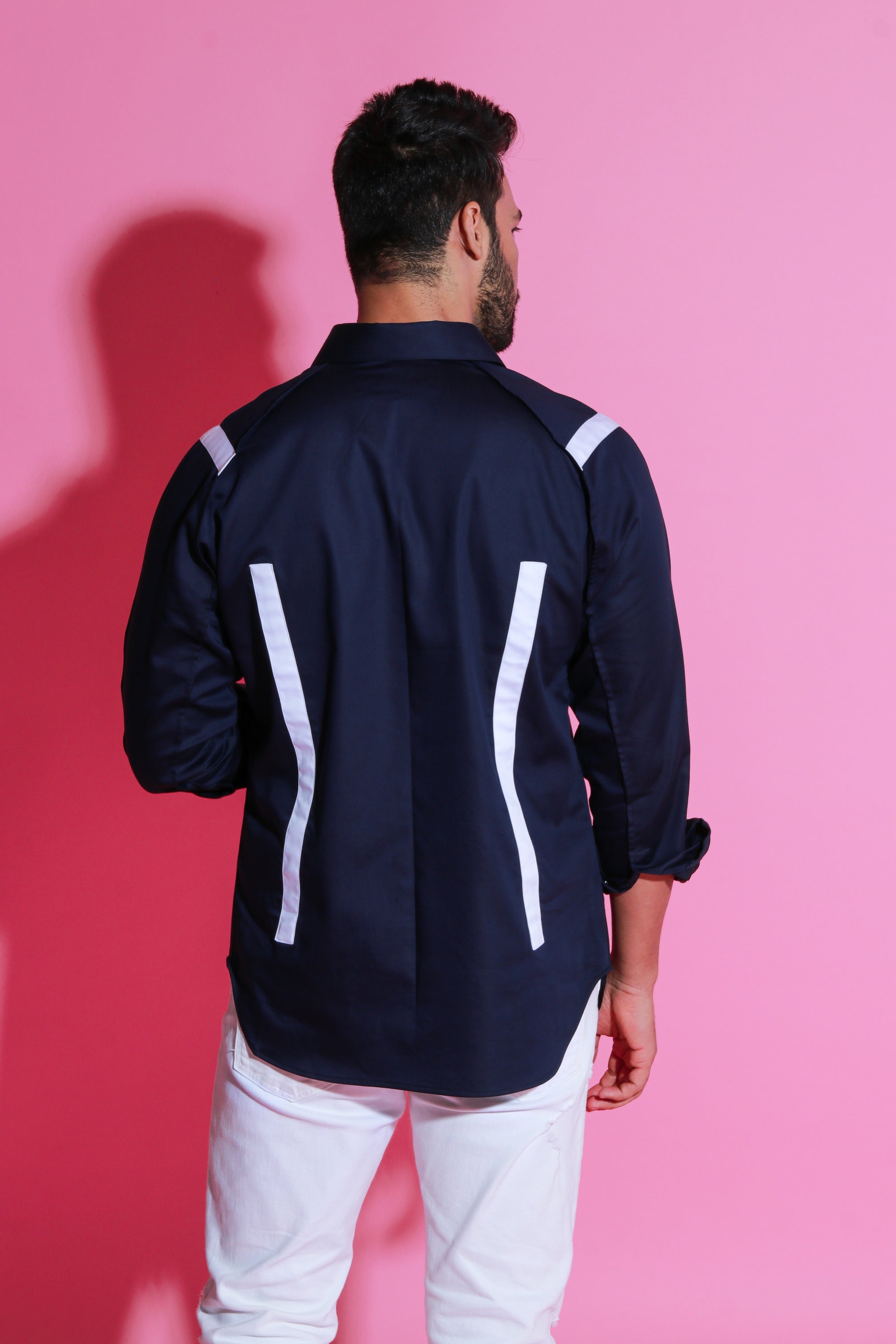 Blue shirt with white strip detailing on shoulders and back.